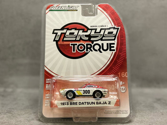 Greenlight 1973 BRE Datsun Baja Z – mașinuță 1:64 stil rally off-road cu grafică BRE retro

