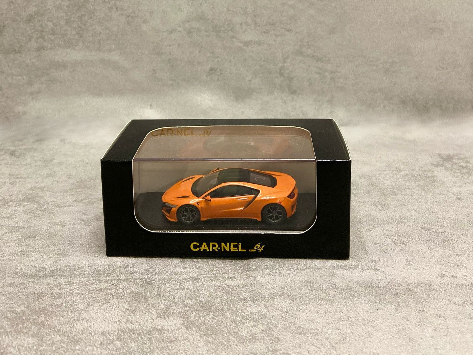 Carnel64 Honda NSX NC1 Orange Pearl – Model 1:64 cu design elegant și finisaj portocaliu perlat